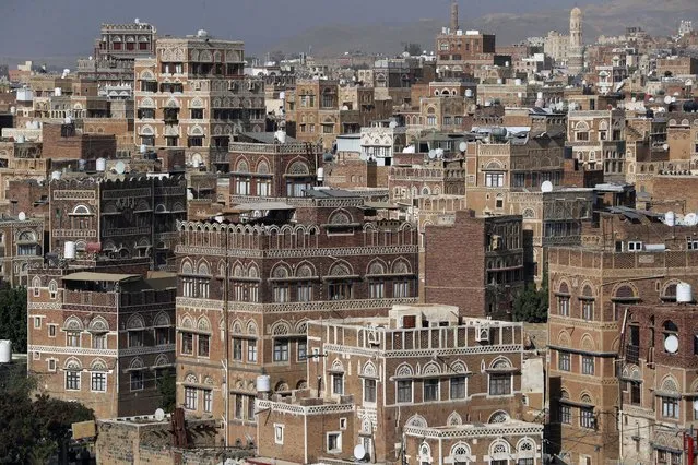 A general view shows UNESCO-listed buildings in the old city of Sana'a, Yemen, 24 February 2023. The old city of Sana'a, located in a mountainous valley over 7,200 feet above sea level, is a dense warren of centuries-old mud-brick buildings. It is one of the oldest continuously-inhabited cities in the world with a legacy of 6,000 multi-story tower buildings, 103 mosques and 14 public bathhouses. The old city was listed as a world heritage site by UNESCO in 1986 as an outstanding expression of Yemen's Arab and Muslim traditional culture. In July 2015, it was inducted to the list of World Heritage in danger due to the damage caused to its cultural heritage by heavy rains and associated flood as well as the armed conflict in the country. (Photo by Yahya Arhab/EPA)