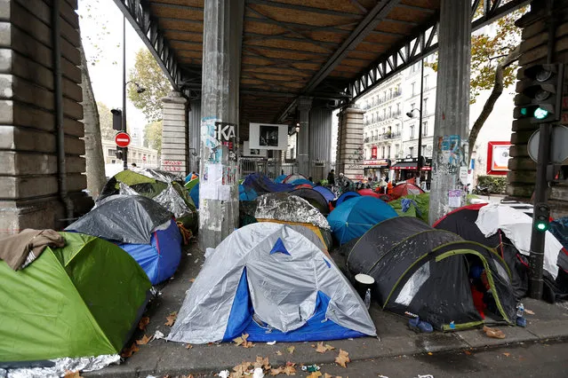 Tents are seen at a makeshift migrant camp under the elevated Jaures metro station in Paris, France, October 28, 2016. (Photo by Charles Platiau/Reuters)