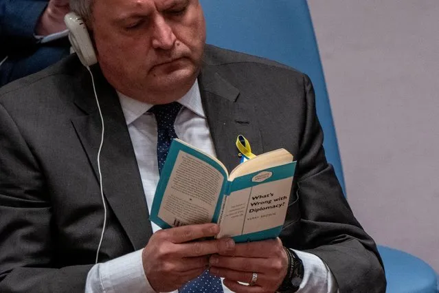 Ukrainian Ambassador to the U.N. Sergiy Kyslytsya reads a book titled “What’s Wrong with Diplomacy?” as Russian Ambassador to the U.N. Vasily Nebenzya speaks to the United Nations Security Council, amid Russia's invasion of Ukraine, at the United Nations Headquarters in New York City, New York, U.S., March 29, 2022. (Photo by David “Dee” Delgado/Reuters)