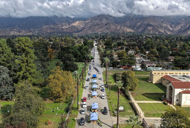 An aerial view of motorists waiting in line to receive free groceries in the aftermath of the federal government shutdown which caused SNAP/CalFresh food benefits delays on November 20, 2025 in Altadena, California. The event was hosted by the Los Angeles Regional Food Bank and L.A. County Board of Supervisors Chair Kathryn Barger and was held near the Eaton Fire burn zone. (Photo by Mario Tama/Getty Images)
