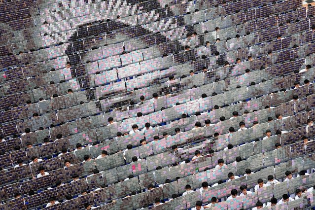 A mosaic portrait of the Queen Mother Sirikit is displayed as students practice flipping boards, at Assumption College in Bangkok, Thailand, Tuesday, November 4, 2025. (Photo by Sakchai Lalit/AP Photo)