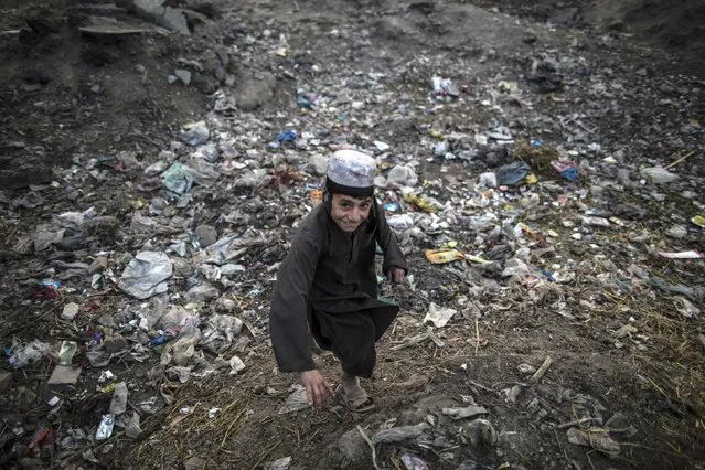 An Afghan refugee boy plays in a slum on the outskirts of Lahore January 12, 2015. (Photo by Zohra Bensemra/Reuters)