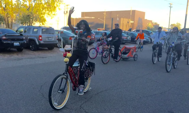 Ashia of the D-Town Riders: “You could be riding next to a millionaire or next to a homeless person, you just don’t know”. Ashia – who has personalised her bike with stuffed toys and a professional red-to-black fade paint job – says she feels much safer riding the streets as part of a club. “It’s positive – and God knows in Detroit, we need positive things like this”. (Photo by Nick Van Mead)