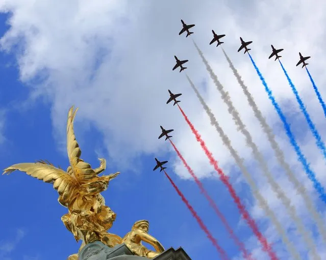 The RAF Red Arrows perform a flypast over Buckingham Palace, central London, following the Trooping of the Colour, on June 15, 2013. (Photo by MoD/PA Wire)