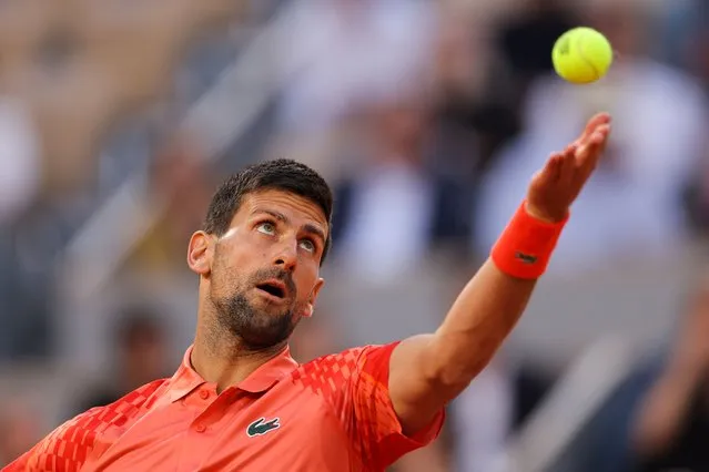 Serbia's Novak Djokovic serves to Hungary's Marton Fucsovics during their men's singles match on day four of the Roland-Garros Open tennis tournament at the Court Philippe-Chatrier in Paris on May 31, 2023. (Photo by Thomas Samson/AFP Photo)