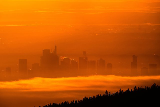 The buildings of the banking district are seen through light fog in Frankfurt, Germany, Monday, December 1, 2025. (Photo by Michael Probst/AP Photo)