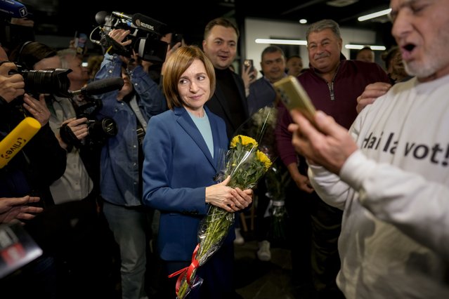 Moldova's President Maia Sandu celebrates with supporters as preliminary results are announced for the presidential election runoff in Chisinau, Moldova, Sunday, November 3, 2024. (Photo by Vadim Ghirda/AP Photo)
