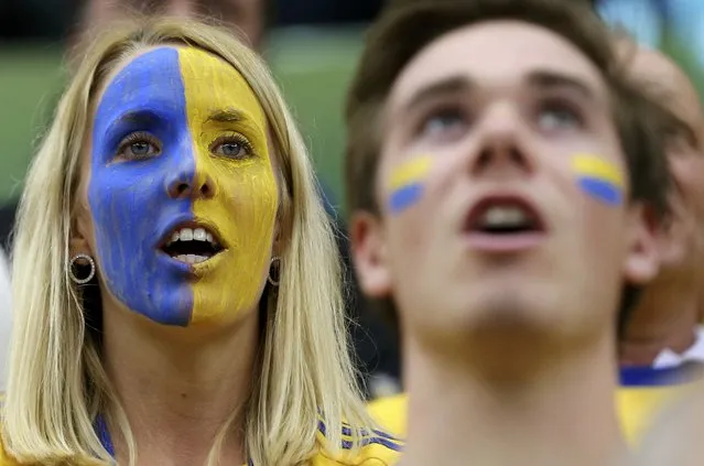 Supporters of Sweden cheer their team before the round of 16 match against Poland during the 24th men's handball World Championship in Doha January 26, 2015. (Photo by Fadi Al-Assaad/Reuters)