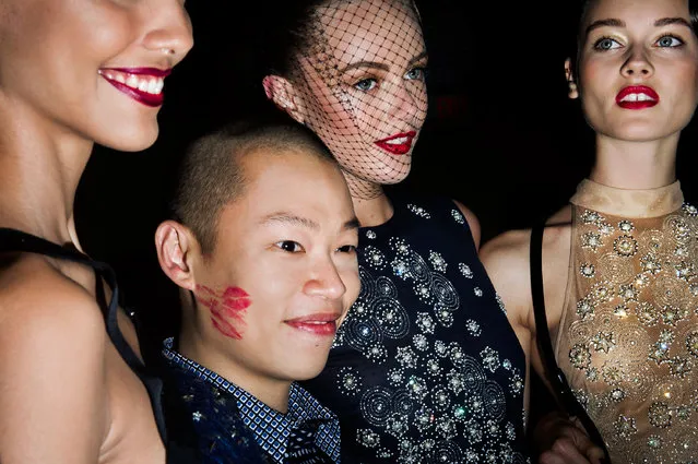Designer Jason Wu and models pose for photographers after his Spring 2013 show in New York City. From the series “Fashion Lust”. (Photo by Dina Litovsky)