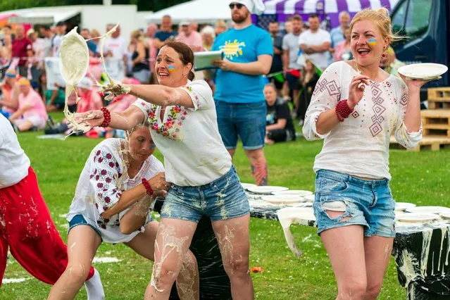 The 54th year of the World Custard Pie Championships held at the village of Coxheath in Kent, England on June 18, 2022. Original planned as a charity event, the championships has gone from strength to strength over the years. This year 22 teams battled it out with custard pies. (Photo by Malcolm Fairman/Alamy Live News)