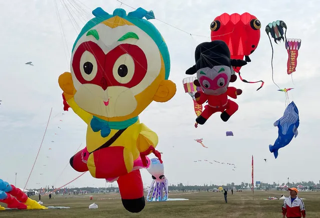 Colorful kites in the shape of Monkey King fly in the sky during 2023 Weifang International Kite Carnival on September 26, 2023 in Weifang, Shandong Province of China. (Photo by Zhang Chi/VCG via Getty Images)