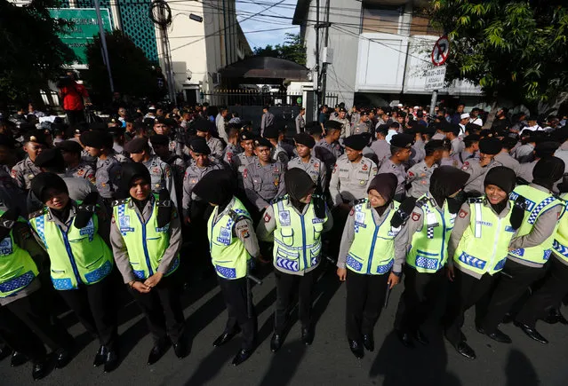 Police provide security outside a court at the blasphemy trial of Jakarta's incumbent governor Basuki Tjahaja Purnama, also known as Ahok, in Jakarta, Indonesia, December 20, 2016. (Photo by Darren Whiteside/Reuters)