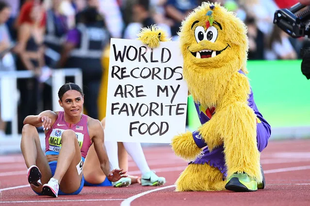 Sydney McLaughlin of Team United States celebrates with Legend the mascot after winning gold and setting a new world record in the Women's 400m Hurdles Final on day eight of the World Athletics Championships Oregon22 at Hayward Field on July 22, 2022 in Eugene, Oregon. (Photo by Hannah Peters/Getty Images for World Athletics)