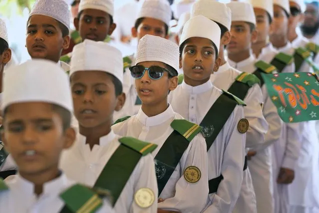 Youngsters in traditional dresses take part in a ceremony celebrating the birthday of Islam's Prophet Muhammad, in Karachi, Pakistan, Friday, September 29, 2023. Thousands of Muslims take part in religious processions, ceremonies and distributing free meals among the poor to mark the holiday. (Photo by Fareed Khan/AP Photo)