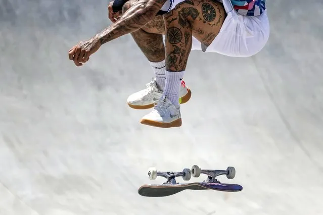 Nyjah Huston of the United States performs a trick in the men's street skateboarding at the 2020 Summer Olympics, Sunday, July 25, 2021, in Tokyo, Japan. (Photo by Ben Curtis/AP Photo)