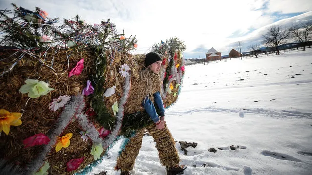 People take part in celebrations marking the “Malanka” winter holiday in the village of Krasnoilsk, western Ukraine, on January 14, 2019. (Photo by Serhii Nuzhnenko/Radio Free Europe/Radio Liberty)
