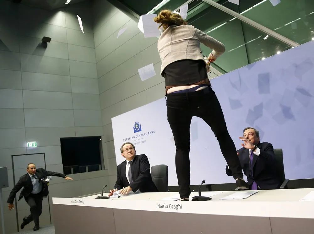 Protester Jumps Mario Draghi