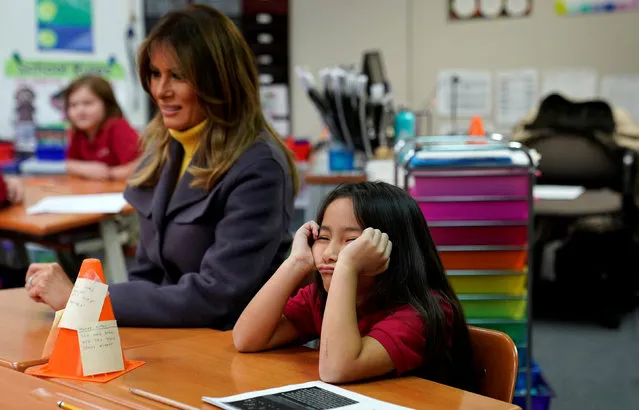 A student sits with her head in her hands as U.S. first lady Melania Trump visits the Dove School of Discovery during a two-day, three-state tour promoting her “Be Best” initiative in Tulsa, Oklahoma, U.S., March 4, 2019. (Photo by Kevin Lamarque/Reuters)