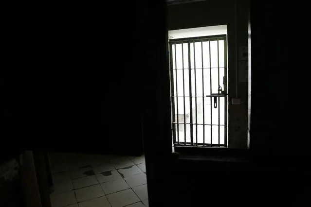 This April 9, 2015 photo shows a gate inside a wing at the now empty Garcia Moreno Prison, during a guided tour for the public in Quito, Ecuador. The building's fate remains undecided, but authorities say one project being looked at would convert the old prison in the heart of the city into a luxury hotel. Another proposal would convert it into a city museum. (Photo by Dolores Ochoa/AP Photo)
