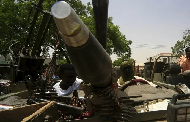 Men sit inside vehicles of the Justice and Equality Movement (JEM) rebels, after Sudanese Armed Forces (SAF) and the Rapid Support Forces (RSF) victory celebrations during a display in Niyla Capital of South Darfur  May 4, 2015. (Photo by Reuters/Stringer)
