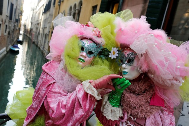 Masked revellers pose during the Venice Carnival in Venice, Italy February 12, 2017. (Photo by Tony Gentile/Reuters)