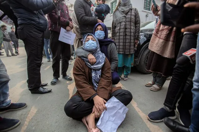Family members and friends of two civilians who were killed in a gunfight, hold a protest, in Srinagar, Indian controlled Kashmir, Wednesday, November 17, 2021. Dozens of relatives of two civilians killed in a controversial gunfight in Indian-controlled Kashmir staged a protest in the disputed region’s main city on Wednesday, pleading authorities to return the bodies of the slain so that they could bury them as per their wishes. (Photo by Mukhtar Khan/AP Photo)