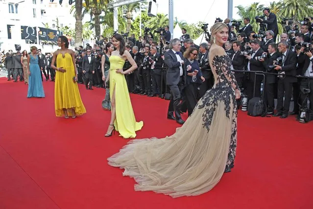 Actress and model Hofit Golan (R) poses on the red carpet as she arrives for the opening ceremony and the screening of the film “La tete haute” out of competition during the 68th Cannes Film Festival in Cannes May 13, 2015. (Photo by Eric Gaillard/Reuters)