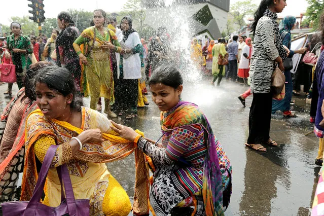Bangladeshi police use water cannon to disperse protesting nurses in Dhaka, Bangladesh 30 March 2016. More than 300 hundred unemployed nurses blocked the Shahbagh intersection demanding a withdrawal of the decision to recruit nurses through examination under Bangladesh Public Service Commission. Police use tearshells and water cannon to disperse the nurses from the streets. (Photo by Abir Abdullah/EPA)