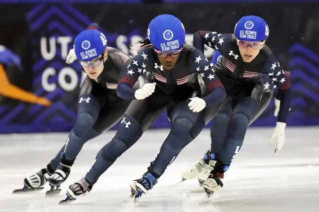 Maame Biney, center, and Kristen Santos, right, and Corinne Stoddard, left, compete in the women’s 500-meter finals during the U.S. Olympic short track speedskating trials Sunday, December 19, 2021, in Kearns, Utah. (Photo by Rick Bowmer/AP Photo)
