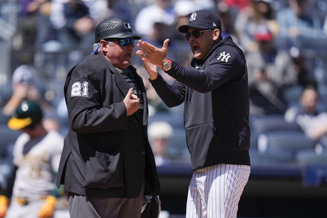 New York Yankees manager Aaron Boone, right, argues with umpire Hunter Wendelstedt during the first inning of the baseball game against the Oakland Athletics at Yankee Stadium Monday, April 22, 2024, in New York. Boone was ejected from the game. (Photo by Seth Wenig/AP Photo)