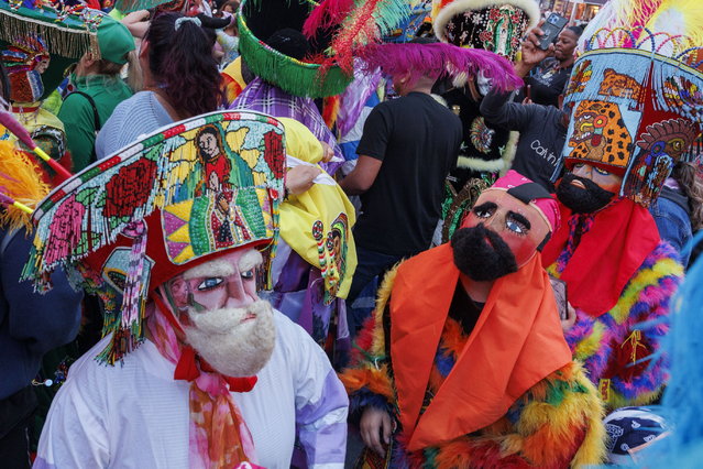 People in costumes dance to the music of the Tlayacapan Brigido Santamaria band, one of the oldest bands in Mexico, while they play a concert at Times Square in New York, New York, USA, 02 May 2024. (Photo by Sarah Yenesel/EPA)
