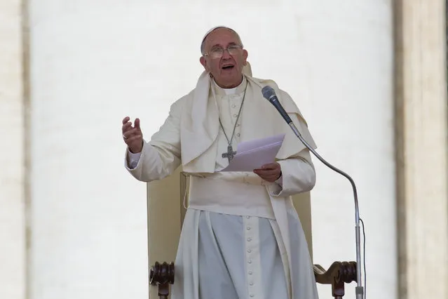 Pope Francis delivers his speech during  his weekly general audience, in St. Peter's Square at the Vatican,  Wednesday, June 17, 2015. Pope Francis has made an appeal as a series of migrant crises rage around the globe: Don't close the door to those seeking a better life. (AP Photo/Andrew Medichini)
