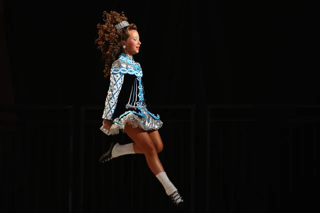 Competitors perform at the World Irish Dance Championship on April 13, 2014 in London, England. The 44th World Irish Dance Championship is currently running at London's Hilton London Metropole hotel, and will host approximately 5,000 dancers competing in solo, Ceili, modern figure choreography and dance drama categories during the week long event. (Photo by Dan Kitwood/Getty Images)