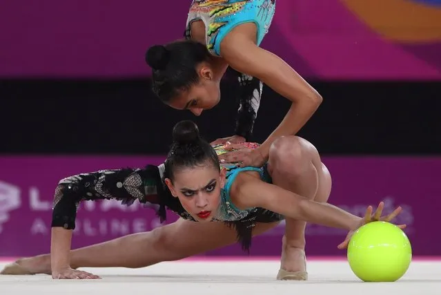 Team Mexico competes in the five balls during the rhythmic gymnastics group final at the Pan American Games in Lima, Peru, Sunday, August 4, 2019. Mexico won the gold medal. (Photo by Pilar Olivares/Reuters)