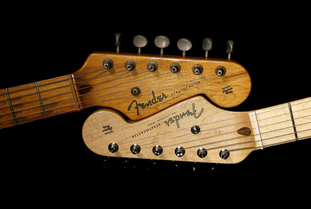 An original 1954 Fender Stratocaster head stock, left, is shown next to a 2014 model, Friday, Jan. 10, 2014 at a studio in Scottsdale, Ariz. April 2014 marks the 60th anniversary of the very first Stratocaster ever sold. (Photo by Matt York/AP Photo)