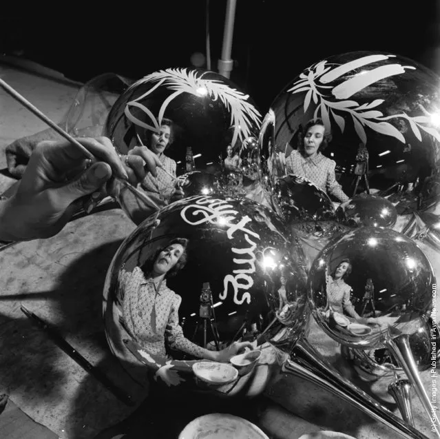 1955: A close-up of a woman making Christmas tree decorations in Crisfield, Maryland