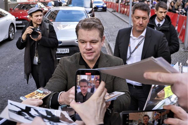 American actor Matt Damon poses signs autographs upon arrival for the photo call for the film “Kiss The Future” during the International Film Festival 'Berlinale', in Berlin, Germany, Sunday, February 19, 2023. (Photo by Joel C Ryan/Invision/AP Photo)