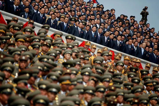 A soldier films North Korean soldiers, officers and high ranking officials  attending a military parade marking the 105th birth anniversary of country's founding father Kim Il Sung in Pyongyang, North Korea, April 15, 2017. (Photo by Damir Sagolj/Reuters)