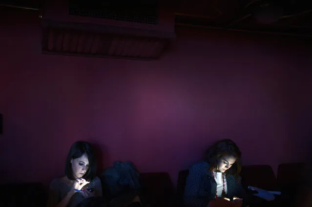 Journalists use their phones during the sixth edition of the Novia Salcedo Awards in Bilbao, Spain, May 19, 2014. (Photo by Vincent West/Reuters)