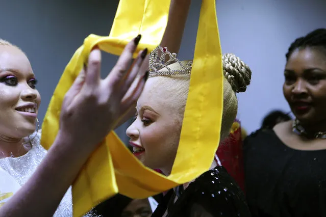 Ayanda Sibanda smiles, after being crowned Miss Albinism Zimbabwe 2019 at an albino pageant held in Harare, early Saturday, May 25, 2019. About 70,000 of Zimbabwe’s estimated 16 million people are born with albinism, according to government figures. They often stand out, making them a subject at times of discrimination, ridicule and dangerously misguided beliefs. The Mr. and Miss Albinism Zimbabwe competition, now in its second year, is a chance to push back. (Photo by Tsvangirayi Mukwazhi/AP Photo)