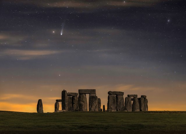 Comet 12P/Pons-Brooks pays a visit to  Stonehenge in Wiltshire in the last decade of March 2024. The photo consists of two photos merged together, one 60-second exposure of the sky using a motorised sky tracker and one 90-second photo of Stonehenge to reveal more detail than the naked eye can see. (Photo by Nick Bull/Picture Exclusive)