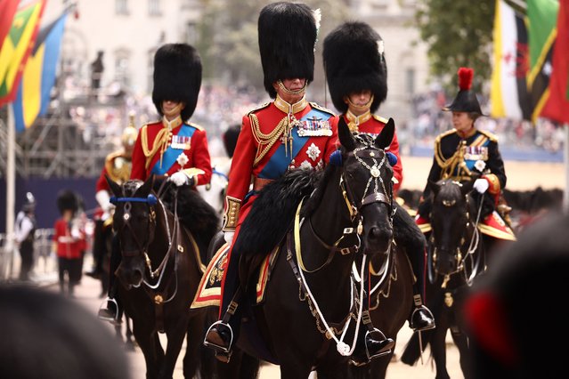 Britain's King Charles III (C) rides back to Buckingham Palace after the King's Birthday Parade, “Trooping the Colour”, in London on June 17, 2023. The ceremony of Trooping the Colour is believed to have first been performed during the reign of King Charles II. Since 1748, the Trooping of the Colour has marked the official birthday of the British Sovereign. Over 1500 parading soldiers and almost 300 horses take part in the event. (Photo by Henry Nicholls/AFP Photo)