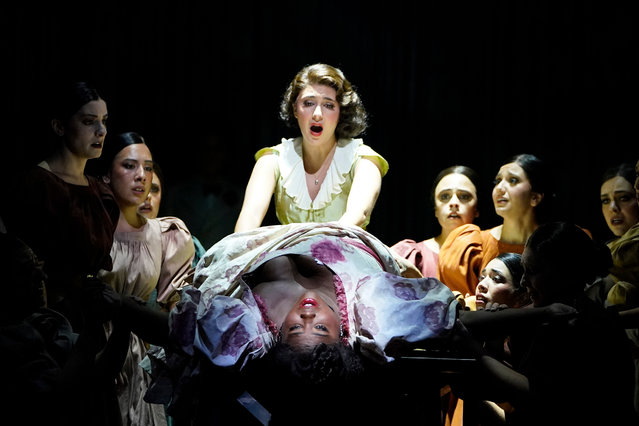 Soprano Angel Blue (front) in the role of Margarita Xirgu and soprano Elena Villalon as Nuria perform a scene from “Ainadamar” by Argentinian composer Osvaldo Grolijov during a dress rehearsal October 11, 2024 at the Metropolitan Opera in New York. The life and death of Spanish poet Federico GarcÌa Lorca debuts on October 15, 2024, at the Metropolitan Opera House in New York in ìAinadamar,î the only opera by Argentine composer Osvaldo Golijov. Composed in 2003, ìAinadamar,î an Arabic word meaning ìFountain of Tearsî in reference to the place where the poet was killed by the fascists in 1936, at the beginning of the Spanish Civil War (1936-1939). (Photo by Timothy A. Clary/AFP Photo)