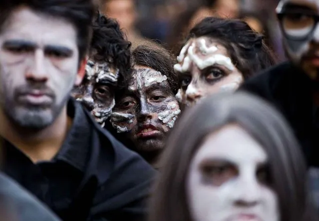 Students take part in a flash mob inspired the Game of Thrones television series, as part of protest to demand education reforms, at the Plaza de Armas in Santiago, Chile, Tuesday, June 28, 2016. Protesters are demanding education reform, including free access to school for all ages, including university level. (Photo by Esteban Felix/AP Photo)
