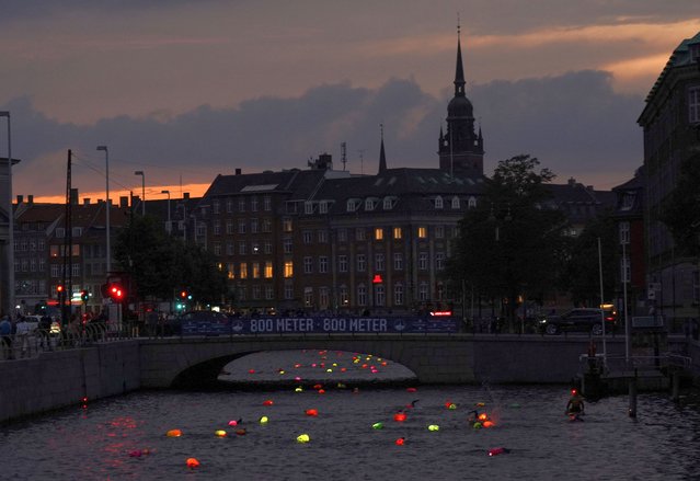 Participants take part in swims through the waterways of the Danish capital as part of TrygFonden Swim event in Copenhagen, Denmark on August 25, 2023. (Photo by Tom Little/Reuters)