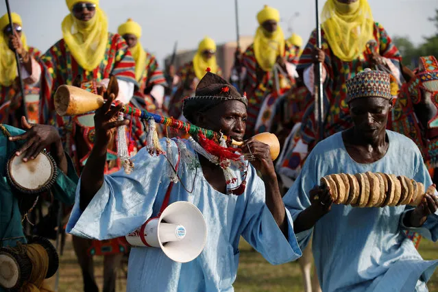 Traditional flutists perform during the durbar festival on the second day of Eid-al-Fitr celebrations in Nigeria's northern city of Kano, July 7, 2016. (Photo by Akintunde Akinleye/Reuters)