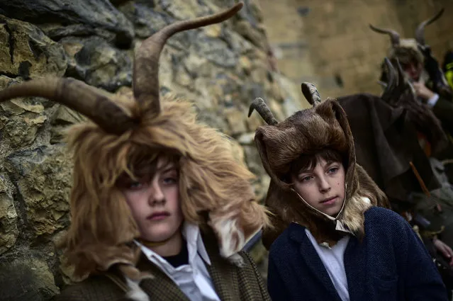 Participants wearing typical regional carnival costumes take part in the carnival in the small village of Enciso, La Rioja Province, northern Spain, Saturday, February 29, 2020. Enciso carnival is a symbol of the end of winter and the start of light and colors on the landscape. (Photo by Alvaro Barrientos/AP Photo)