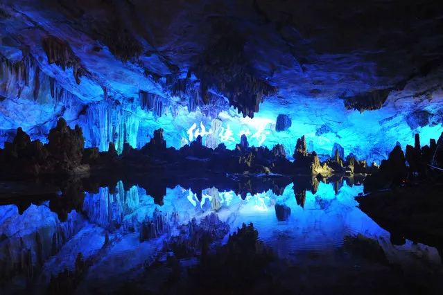 Photo taken on April 9, 2013 shows the scenery of stalactites inside the Reed Flute Cave in Guilin, south China's Guangxi Zhuang Autonomous Region. The World Heritage Committee on Monday inscribed an extension of South China Karst, a natural World Heritage Site since 2007, into the UNESCO's World Heritage List. (Photo by Lu Bo'an/Xinhua)