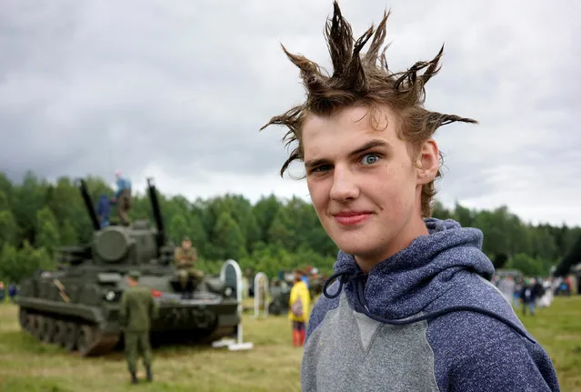 A reveller poses for a picture as he attends the Nashestvie open-air festival of Russian rock music that also exhibits Russian military transport and equipment in Tver region, Russia, July 8, 2016. (Photo by Maxim Zmeyev/Reuters)