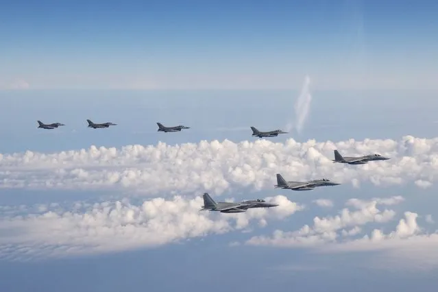 In this photo provided by the Joint Staff of the Japanese Self-Defense Force, three F-15 warplanes of the Japanese Self-Defense Force, front, and four F-16 fighters of the U.S. Armed Forces fly over the Sea of Japan on Wednesday, May 25, 2022. Japanese and U.S. forces conducted the joint fighter jet flight over the Sea of Japan, Japan’s Defense Ministry said Thursday, in an apparent response to a Russia-China joint bomber flight while U.S. President Joe Biden was in Tokyo. (Photo by Joint Staff of the Japanese Self-Defense Force via AP Photo)